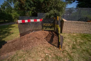 Post stump grinding hole filled in with grindings